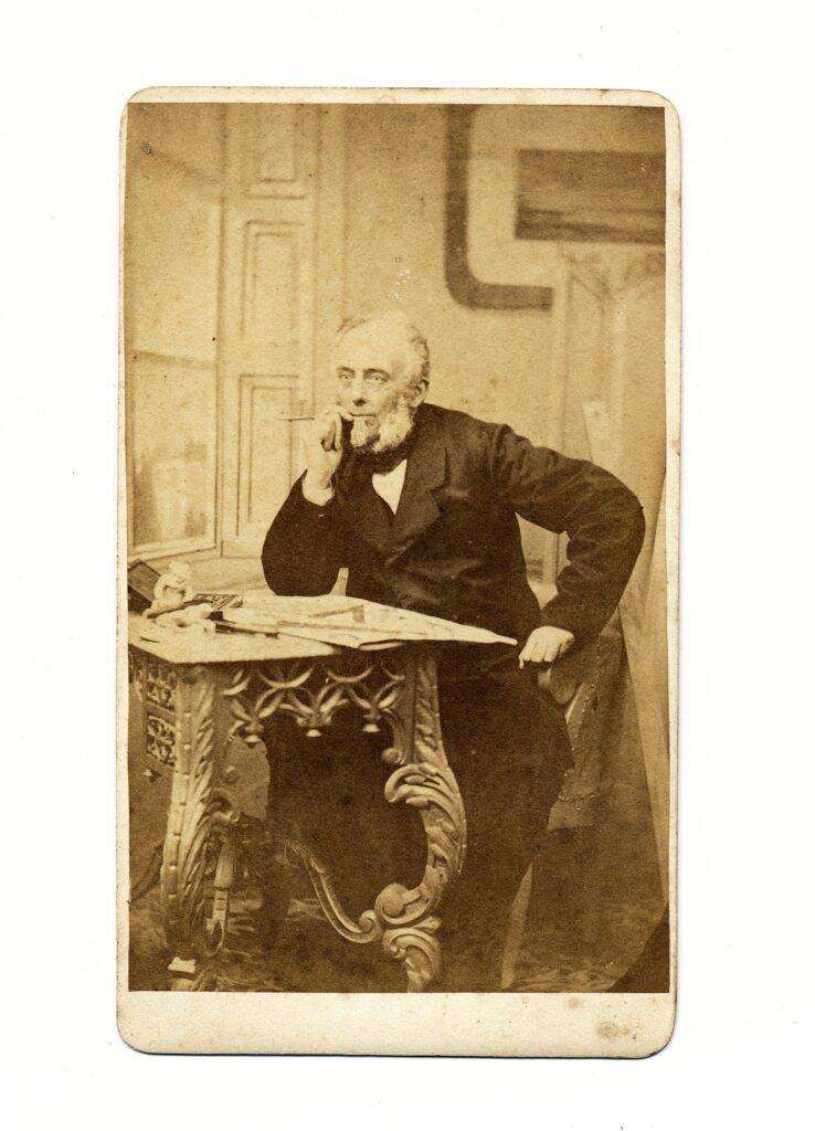 Bekijk de foto's 1 van W.C. van Dijk: man aan een tafeltje, Utrecht ca. 1868
