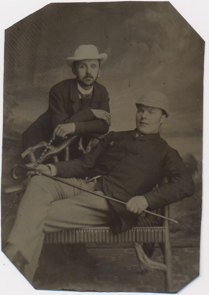 Bekijk de foto's 1 van Onbekend: twee mannen op een bankje, Nederland ca. 1875